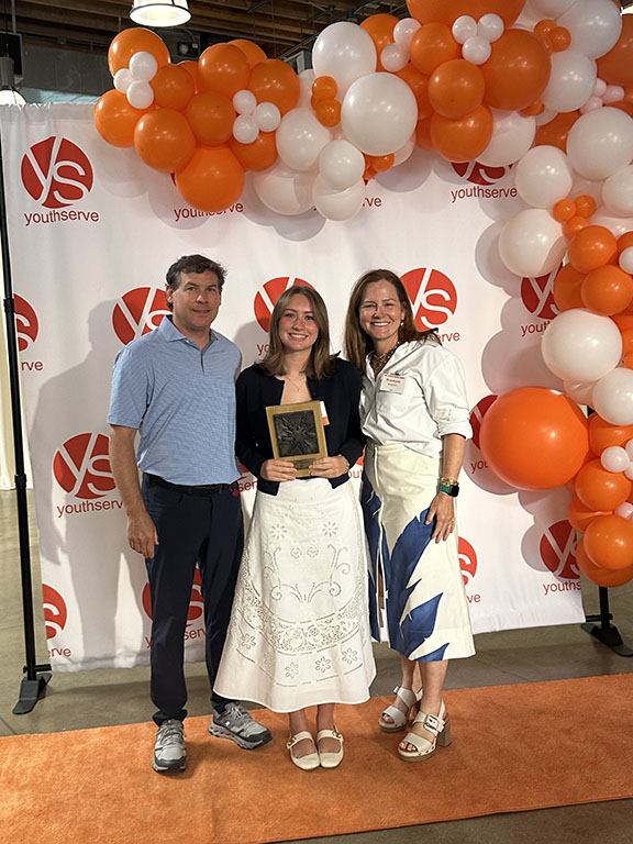 Wall of book awards earned by Callie Chapman including Mom's Choice, Moonbeam, Purple Dragonfly, Royal Dragonfly, Paris Book Festival, New York Book Festival, NIEA and AFP Outstanding Youth in Philanthropy